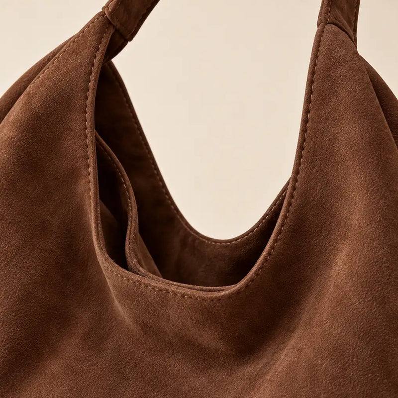 Close-up of the Coffee faux suede shoulder bag texture and tonal stitching