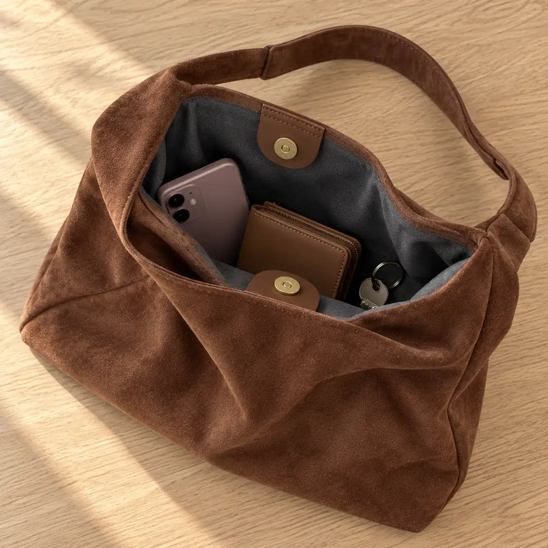 Open Coffee faux suede shoulder bag with dark lining, magnetic snap, phone, wallet and keys